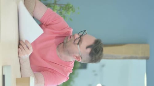 Man Reading Documents Looks Distressed Vertical Video