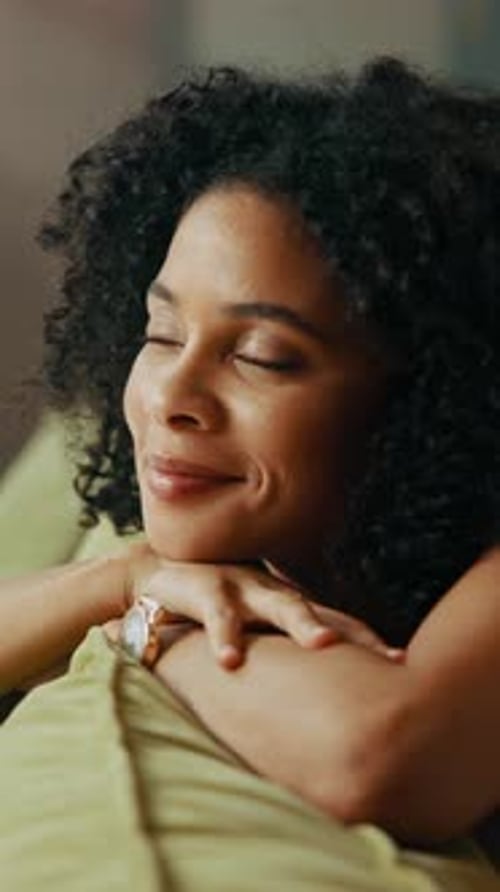 Relaxing Woman Leans on Arms Indoors