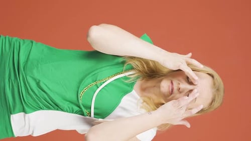 Blonde Woman with Headache in Studio