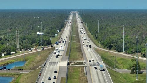 Above View of Wide Highway in Florida with Fast Driving Cars During Rush Hour USA Transportation