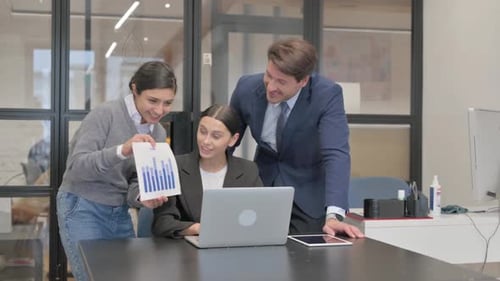 Colleagues Collaborating During Video Conference in Modern Office
