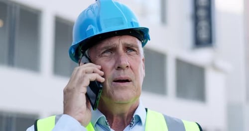 Construction Supervisor Talking on Smartphone Wearing Hardhat