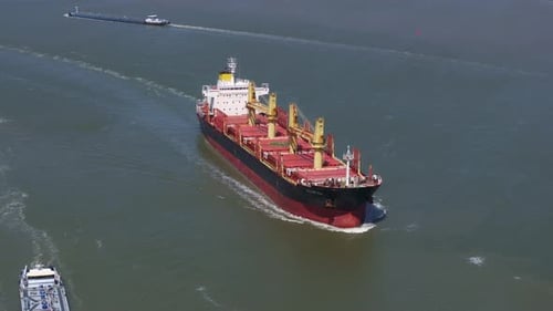 Aerial view of cargo ship on river, Westerschelde, Netherlands.