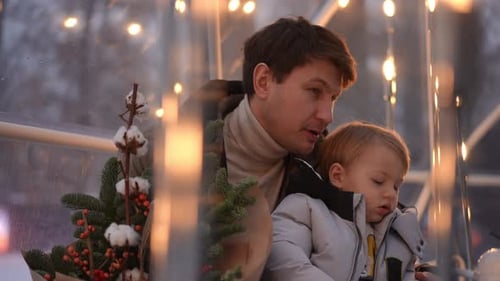 Father and Child Celebrate Winter Holidays