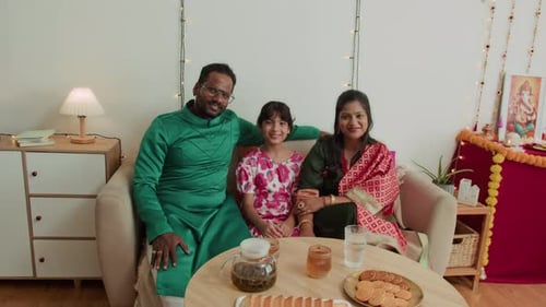 Smiling Family Celebrating at Home Together