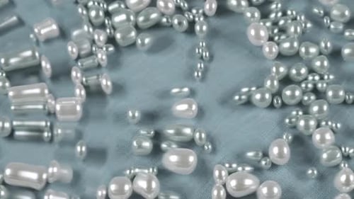 Shiny Pearls Design Elements on Light Blue Surface