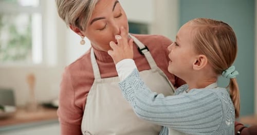 Woman and Child Enjoy Baking and Making a Mess