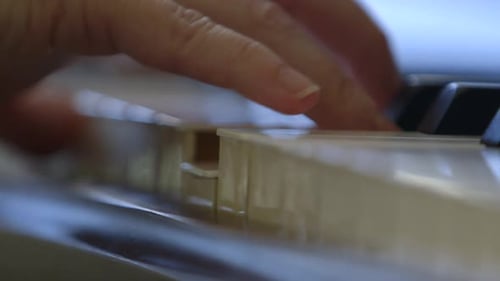 Close Up Of Musician's Hands Playing The Piano.