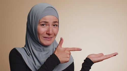 Woman Pointing Empty Place Advertising Area for Commercial Text Copy Space for Goods Promotion