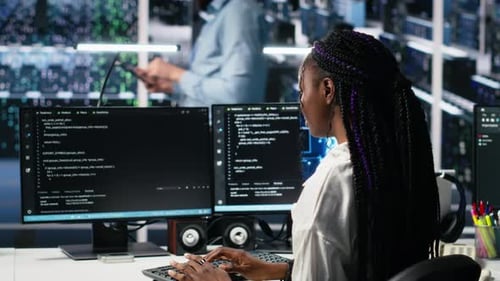 Technicians in Data Center Review AI Diagnostics Analyzing Neural Networks