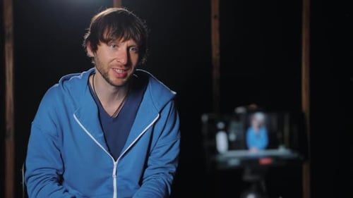 Piano Teacher is Using His Mobile Phone to Record His Online Music Lesson