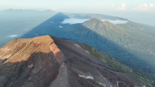 Shadow of mount agung (active volcano) looking towards mount Batur - Bali - Indonesia.