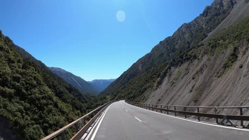View from a vehicle driving on famous Arthurs Bridge in National Park New Zealand, shot handheld on
