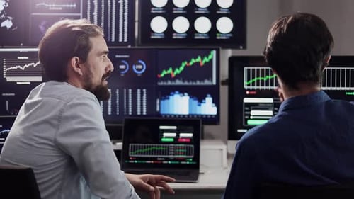 Financial Analysts Reviewing Stock Market Data Together