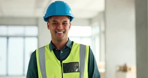 Smiling Construction Worker in Hard Hat and Vest