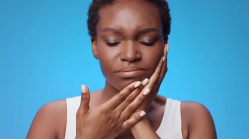 Woman with Natural Hair Posing on Blue Background