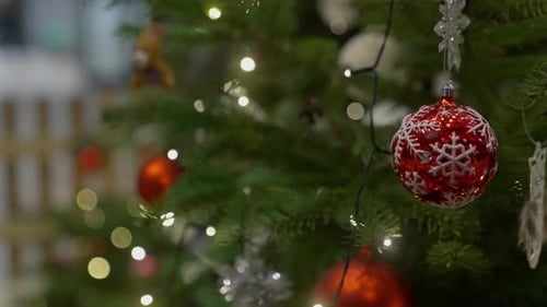 Christmas Tree with Red Ornaments and Twinkling Lights