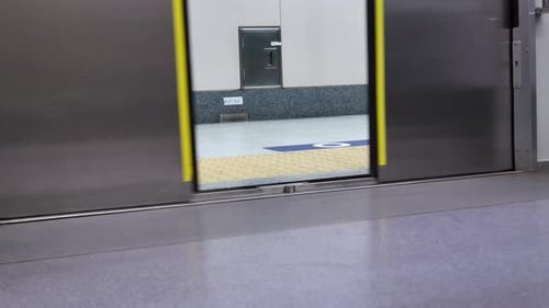POV zoom into train/subway's door while door is closing when prepare to leaving from station. Train/