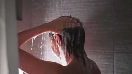 Woman Rinsing Hair in Shower