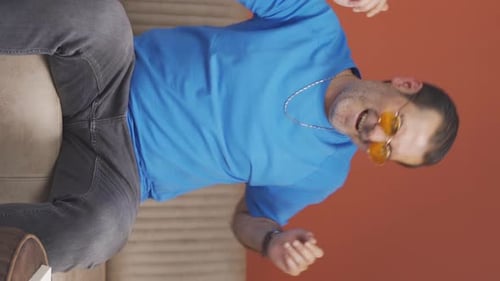 Vertical video of Happy man dancing.