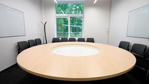 Modern Meeting Room with Round Table and Chairs