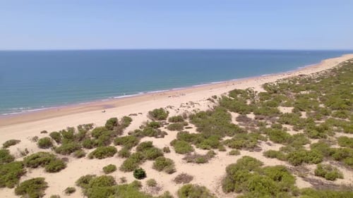 Flight over the beach line and sandbanks. Coast line and beach aerial view. Andalusia. Spain.