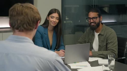 Professionals in a Meeting around Conference Table
