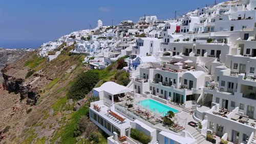 Stunning Aerial Views of Santorini's Whitewashed Villas Overlooking the Aegean Sea