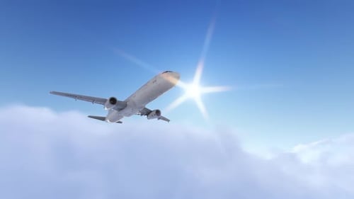 Passenger Airplane Flying Above Clouds in Bright Blue Sky