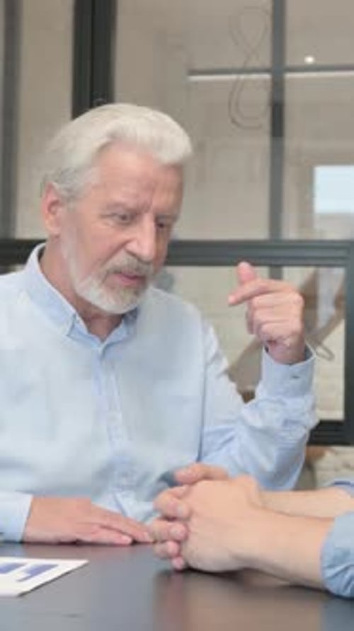 Business People Discussing Project in Office, vertical video