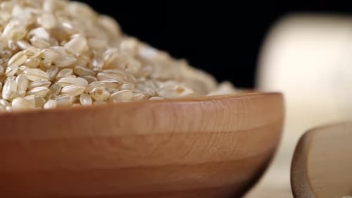 Macro Shot of Grain in Wooden Bowls