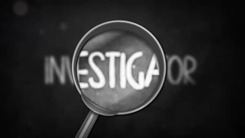 Magnifying Glass Reveals Chalk Text on Blackboard