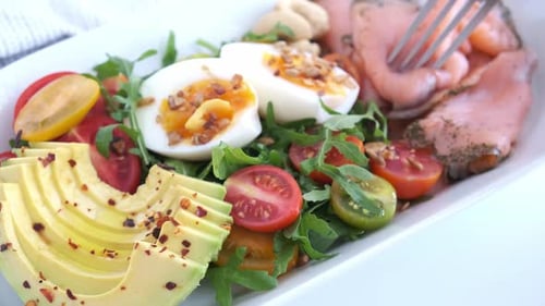 Delicious Salmon and Avocado Salad Served on Plate