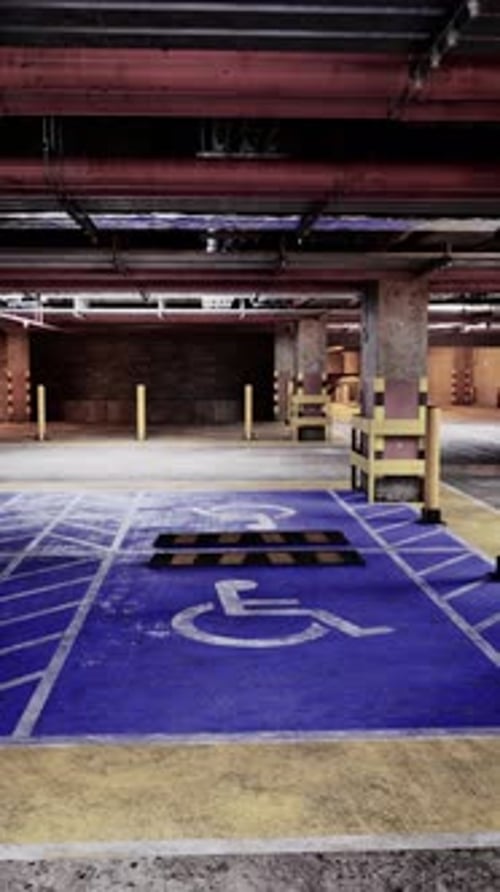 Empty Parking Garage With Handicap Sign