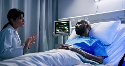 Doctor, healthcare or discussion with man in hospital bed for health recovery