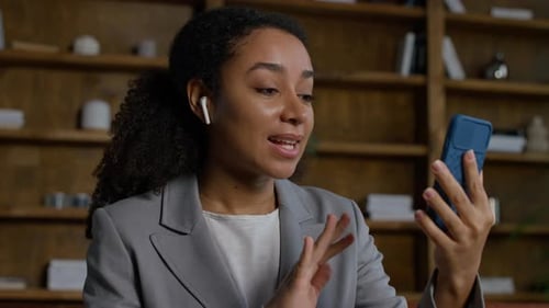 Young Woman in Business Attire on Video Call
