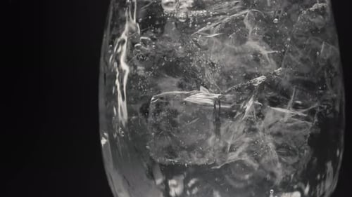 Clear Glass of Refreshing Ice Water Bubbles