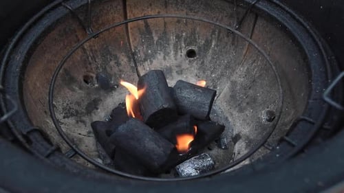 Starting a grill with lump charcoal