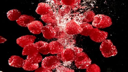 Raspberries Plunging into Water in Stunning Detail