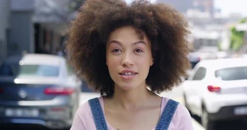 4k video footage of a young woman being interviewed about her internet speed on the street