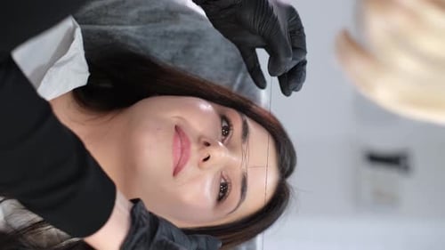 Woman Gets Eyebrow Treatment at Beauty Salon