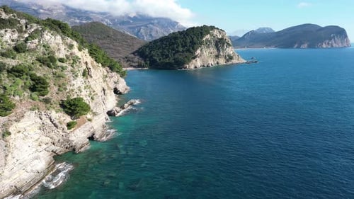 Aerial View of Beautiful High Cliffs Standing Near the Shore and Washed By Clear Sea Water