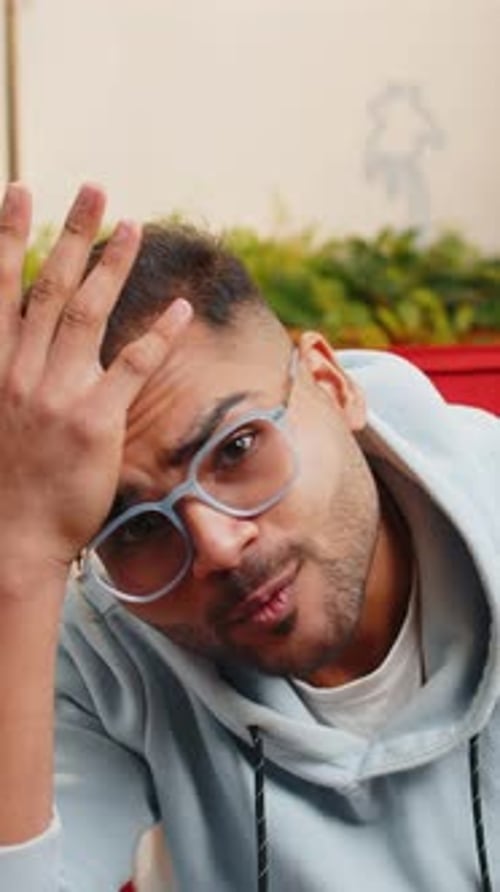 Man Wearing Glasses Looks Annoyed