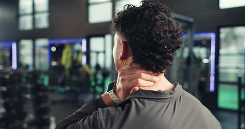Back, hand and man with neck pain in gym, fitness injury or muscle tension with pressure