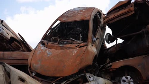 Echoes of Conflict BulletRiddled Cars in Ukraine Ravaged Vehicles Bear the Scars of War Concept War