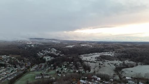 Morning Aerial of Morgantown, West Virginia with Light Snow and Gray Skies Overhead