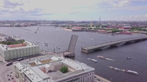 Saint-Petersburg, an aerial drone footage of an open bridge in Neva river, boats in a river, channel