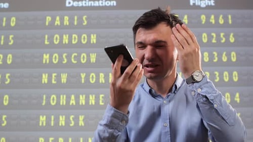 Angry Passenger Expressing His Frustration with Travel Disruption and Flight Delays Talking Loudly