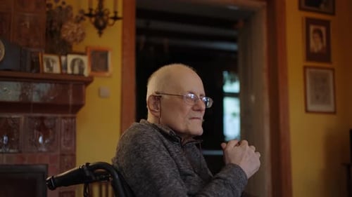 Senior Man in Wheelchair Sitting Indoors