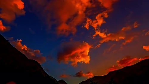 Time lapse moving clouds passing golden sky after sunset sunrise sun nature